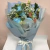 Light blue roses with white &amp; peach lisanthus and baby breathe 