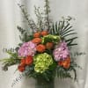 An Enchanting Floral Arrangement with Blue Delphinium, Blue Hydrangea, Red Hypericum, Orange