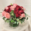 Embrace modern elegance with our exquisite floral arrangement featuring a striking combination