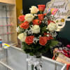A mix of premium white roses paired with delicate coral roses, creating