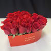 Freshly picked red roses arranged in a heart shape box.