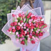 Brighten any occasion with this breathtaking pink and red tulips bouquet, beautifully