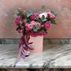 The &quot;Crimson Elegance&rdquo; features deep burgundy roses paired with fresh eucalyptus. The