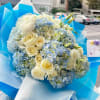 Celebrate the joy of a newborn baby boy with this exquisite bouquet