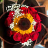 A striking bouquet featuring a radiant sunflower at the center, surrounded by