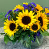 A radiant mixed arrangement that showcases vibrant and cheerful yellow Sunflowers that