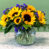 A radiant mixed arrangement that showcases vibrant and cheerful yellow Sunflowers that