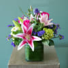 Stargazer lilies, pink roses, purple lisianthus and green hydrangeas - arranged to