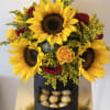 Beautiful sunflowers and roses, combined with Ferrero Rocher chocolates in a contemporary