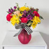 A bright bouquet of daisies and other seasonal blooms! 
Vase color and