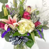 This is a gorgeous arrangement full of stargazer lilies, hydrangeas, eucalyptus, roses