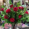 One dozen red roses in a nice container and premium greenery! 