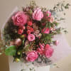 Large, lush hand-tied wrapped mixed bouquet using fresh seasonal flowers. Picture is