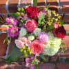 Seasonal palette of soft pastel shades arranged with assorted foliage.
Presented in a