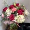 Experience the beauty and grace of this exquisite arrangement featuring a harmonious