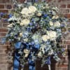 A beautiful floral tribute for the deceased. A lush palette of blue
