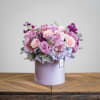 A dusty lavender velvet cylinder box is flourishing with out favorite pastels.