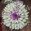 100 one dollar bills made into a beautiful bouquet. Custom made to