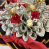 100 one dollar bills made into a beautiful bouquet. Custom made to