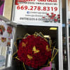 Buchon style wrapped 100 roses. Color of choice. 