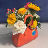 A vibrant mix of yellows, whites, and pinks, playfully arranged in a