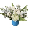 All white flowers designed in a turquoise colored glass vase. 
Flowers included