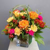 High Magic, bright roses and beautiful blooms in a modern square vase.