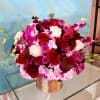 This beautiful gold vase is designed with the perfect magenta, lavender, white