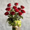 Simple elegance.... this lovely glass footed vase holds 1 dozen Imported Ecuadorian