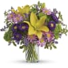 Golden roses and lilies, lavender blooms and bright greens are a recipe
