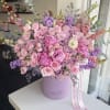 Pink velvet box with pink and lavender flowers.
Standard size same as pictured.