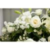This casket spray with heavenly white flowers is perfect for a gracious