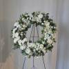 A beautiful wreath hanging on a stand, perfect for the church or
