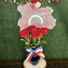 Red roses on a blue vase with patriotic ribbon
&quot;Picture is a reference