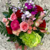 Our signature mixed arrangement combines a delightful blend of red, blush and