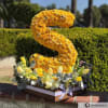 Surprise someone with a personalized initial arrangement for their birthday, anniversary or