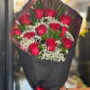 12 red roses and filler wrapped in paper (black, brown, white, or