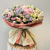 Experience luxury with our Blooming Symphony Bouquet, an awe-inspiring arrangement of over