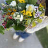 Traditional bouquet of white roses, daises, lilies, sunflowers, Alstroemerias and other blooms.