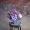 Pretty pinks, lavender and indigo colored flowers are sprinkled through this unique