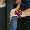 A simple corsage designed to tie on the wrist using flowers to