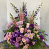 A beautiful expression of sympathy! Garden- style wicker basket design including a