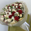 Timeless elegance meets romantic charm in this bouquet of red roses, white
