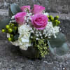 This elegant pastel arrangement has hydrangeas, roses, Hypericum, babies, breath, and eucalyptus