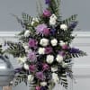 This beautiful spray has Purple Roses, Lavender Spider Mums, White Carnations, White