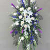 This beautiful spray has White Roses, White Snap Dragons, White Asiatic Lillys