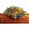 Full of amazing beauty and love, this colorful casket spray celebrates a