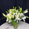 Sympathy flower arrangement with assorted white flowers 