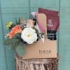 A Flower arrangement and a Drinking Chocolate set is a perfect gift