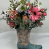 A beautiful mix of Gerbera Daisies, Ranunculus, Rose with accent flowers in